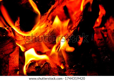 yellow and red flames on a black background