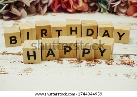 Happy Birthday alphabet letter on wooden background