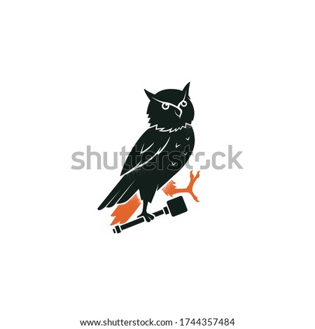Owl symbol of wisdom. Heraldic owl passant of a family crest. Vintage bird vector emblem. Black silhouette logo design, engraving, retro style.