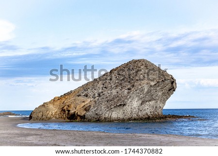 Large volcanic rock from the famous Los Genoveses beach, in the Cabo de Gata natural park, in Almería.  filming location for Indiana Jones and the Last Crusade Royalty-Free Stock Photo #1744370882