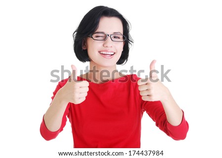 Beautiful young woman in casual clothes gesturing thumbs up. 
