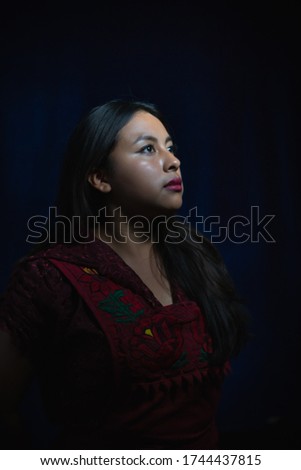 beautiful young woman in traditional dress of her population