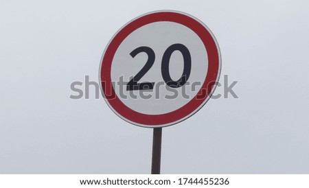 car speed limit sign on the road