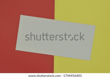 White paper template on colorful background. Top view and copy space.