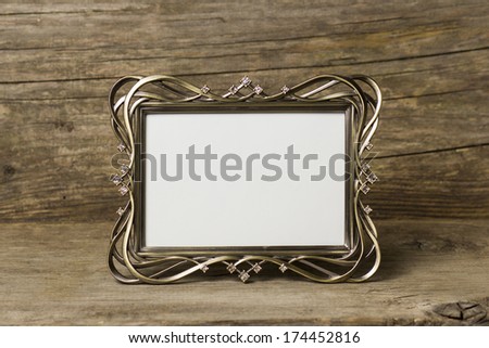 beautiful photo frame on old wooden background