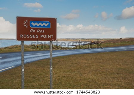 Rosses view point sign by the road, Ocean and blue cloudy sky in the background. Sligo, Ireland.