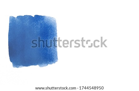 Watercolor blue abstract brushstroke on a white background. Trendy Color of the year 2020 classic blue. Sample of classic blue paint on white isolated background.Texture of blue paint. Copy space.