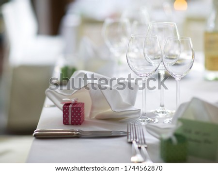 Decoration at a wedding with glasses and a laid table