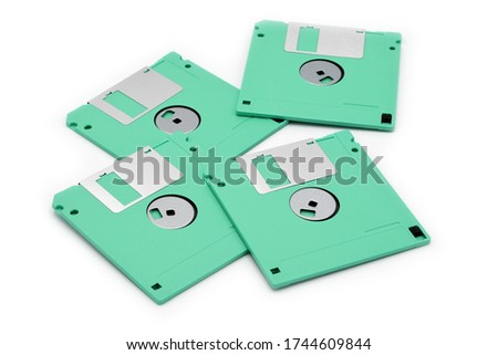 green floppy diskettes on white