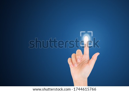 Technology, Internet, Digital and Networking Security Concept : Finger hand touching and pressing virtual fingerprint icon symbol on screen.