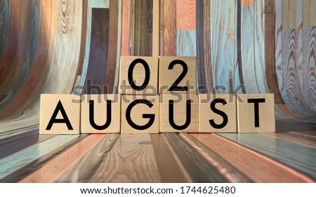 August 2.August 2 on wooden cubes on a wooden background. An image for a holiday .Summer day. Calendar 