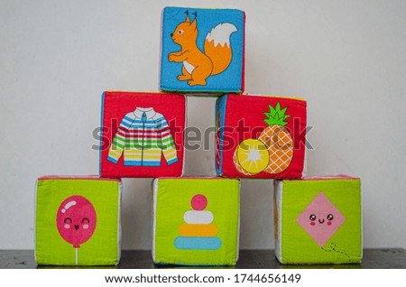 toy soft cubes with different images