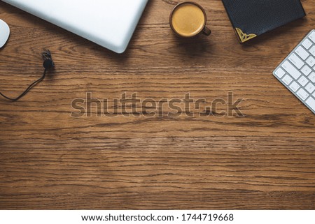 Flat lay composition with coffee, keyboard,
lapel microphone, notepad and other office related objects ob wood  background