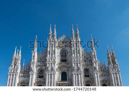 Horizontal picture of the top of Duomo di Milano, an important catholic cathedral in Milan, Italy.