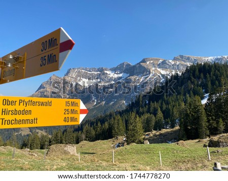 Mountaineering signposts and markings on the hills over the Eigental alpine valley and in central Switzerland, Eigenthal - Canton of Lucerne, Switzerland