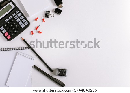 office workplace, calculator and office supplies on the table top view