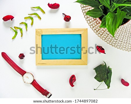 Flat lay of wooden picture frame with home decoration. Mock Up for text. Summer composition with copy space.                                