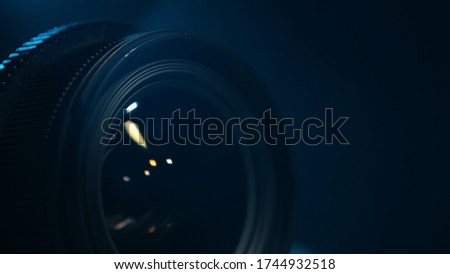 Photographic camera lens - close up - black background