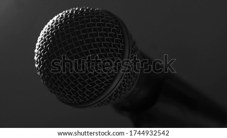 Macro shot of a stage mic professional vocal microphone - low key backlight