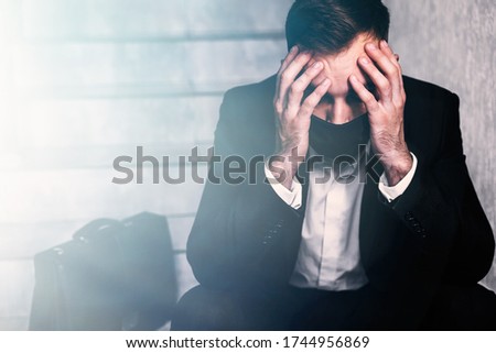 despressed office worker lost all his money sit on stairs Royalty-Free Stock Photo #1744956869