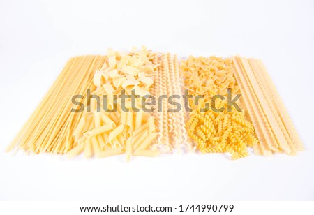 Different types of pasta on a white background