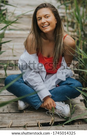 Young cute woman in nature