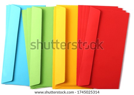 Isolated colourful bright paper envelopes on the white background as the post a letter or mailing  concept
