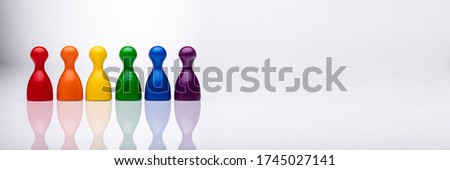 Recruitment Inclusion And Diversity. Leadership Group And Pawn Row  Royalty-Free Stock Photo #1745027141