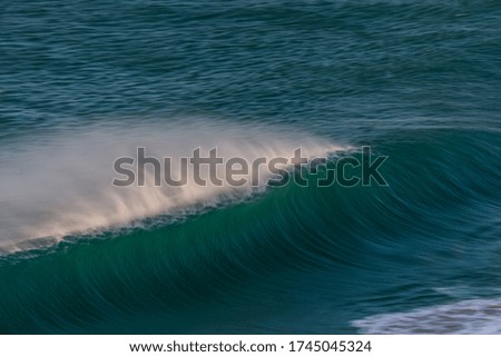 huge wave crashing in the ocean
