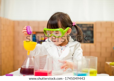 toddler girl pretend play scientist role for homeschooling 