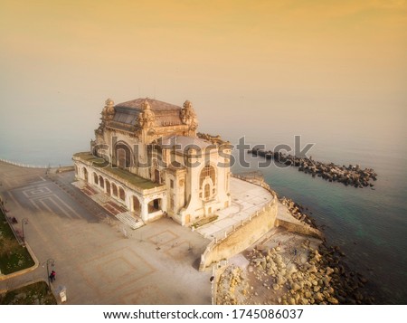 Aerial View Of Constanta City Skyline In Romania. Incredibly beautiful and scary. the abandoned casino under the fiery sky at sunset.representative symbol of the city on the coast of the Black Sea.