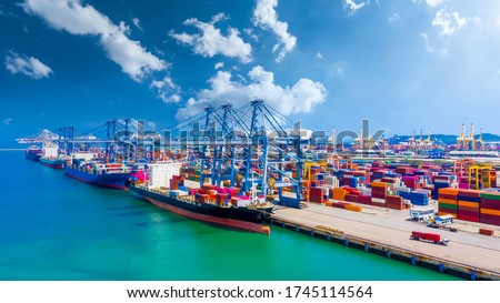 Container ship in deep seaport terminal with quay crane, Global industrial transport cargo and logistic business import export, Container cargo vessel freight shipping company commercial worldwide. Royalty-Free Stock Photo #1745114564
