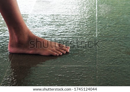 Non-slip floor tiles of the swimming pool with feet clipping path Royalty-Free Stock Photo #1745124044
