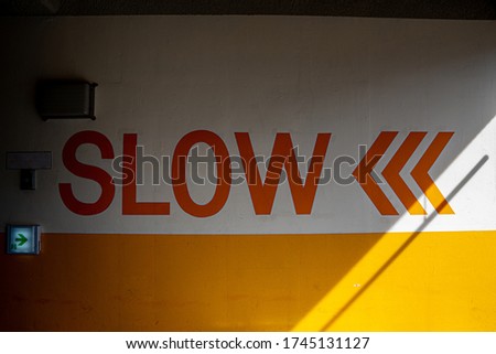 slow sign is painted on the wall