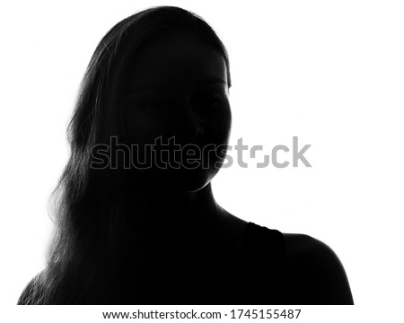 Female person silhouette in the shadow, back lit light Royalty-Free Stock Photo #1745155487