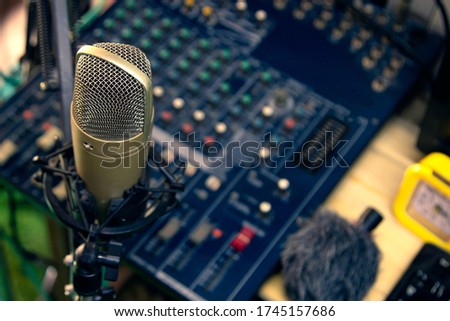 Condenser microphone on the console Professional recording equipment.