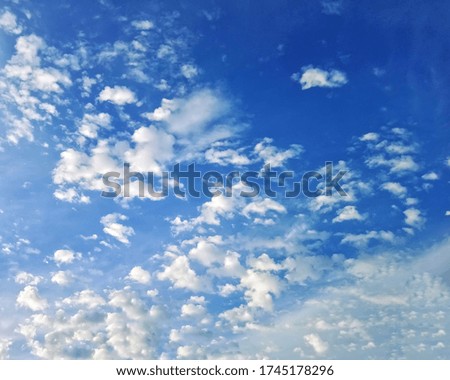 Blue evening sky with beautiful cumulus clouds