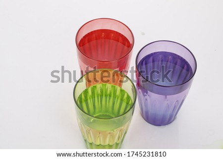multi colour cold drink glass isolate on white background.with straw and umbrella .