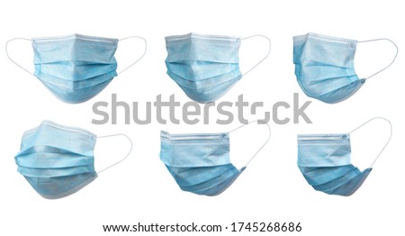 Medical face mask isolated on white background with clipping path around the face mask and the ear rope. Concept of COVID-19 or Coronavirus Disease 2019 prevention by wearing face mask. Royalty-Free Stock Photo #1745268686