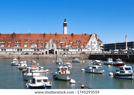 Calais lighthouse and port wharf in the north of France Royalty-Free Stock Photo #1745293559