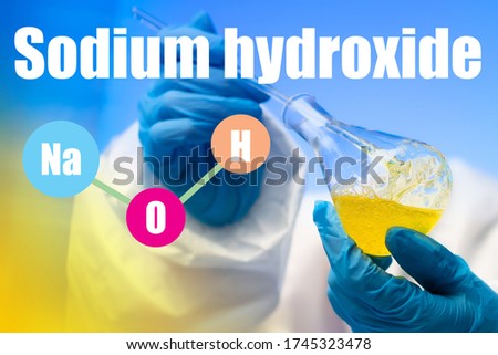 NaOH. Sodium hydroxide. Chemist mixes alkali in a flask. Concept - caustic soda in the hands. Chemist synthesizes leading substances. Scientific experiments with NaOH. Study of the  sodium hydroxide Royalty-Free Stock Photo #1745323478