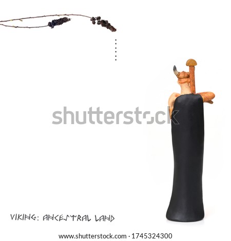 Tourist souvenir from Norway "Old Viking with a sword" isolated on white background