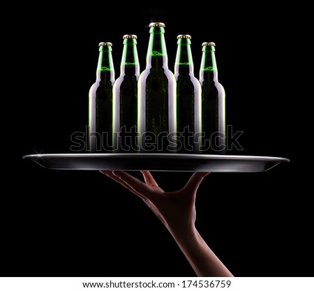 waiter hand and tray with Beer bottle