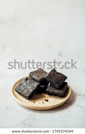 Dark chocolate brownie on white background