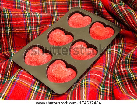 Red candy in sugar in the form of hearts