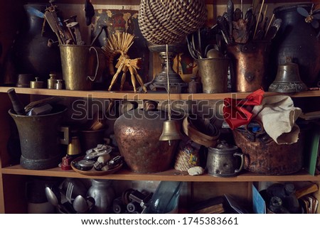 Antique collector's shelf in which the spirit of past centuries is present, nostalgic still life, collector's house