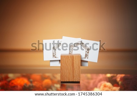 A business card on a wooden stand. Hight quality photo