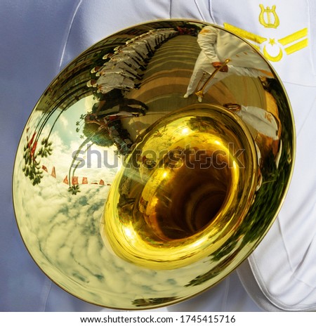 Musical Instrument of Tuba's  Reflections: Background of the military band.