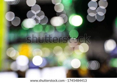 The colorful bokeh lights from vehicles on the road with traffic in dark night , in vintage film color style