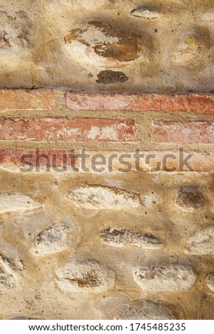 Front view of an old brick wall in Spain.
